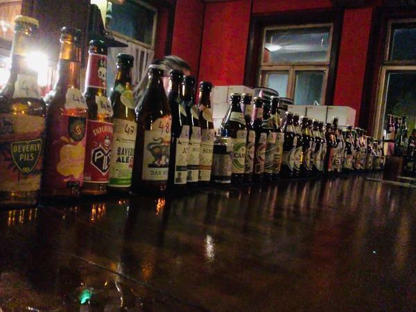 A line-up of craft beers in a bar